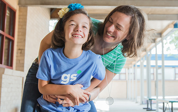 mother and daughter embracing and smiling