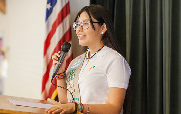 girl speaking into microphone